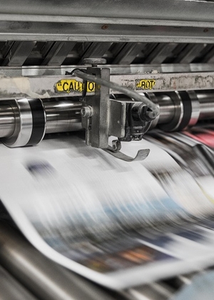 Newspapers on press