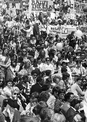 A black and white photo showing a large group of women attending a Equal Rights Amendment (ERA) event.