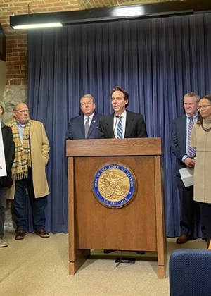  State Sen. Steve Stadelman, D-Loves Park, at podium, talks about the Local Journalism Task Force's report during a news conference at the Capitol on Jan. 16, 2024. Photo by Alex Abbeduto/Capitol News Illinois 