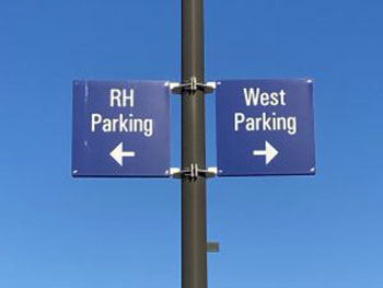 Signage designating (RH) and (WEST) parking