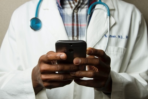 Doctor using a Mobile