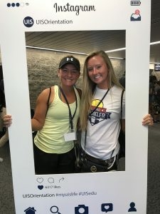 Two incoming students pose for a picture at orientation
