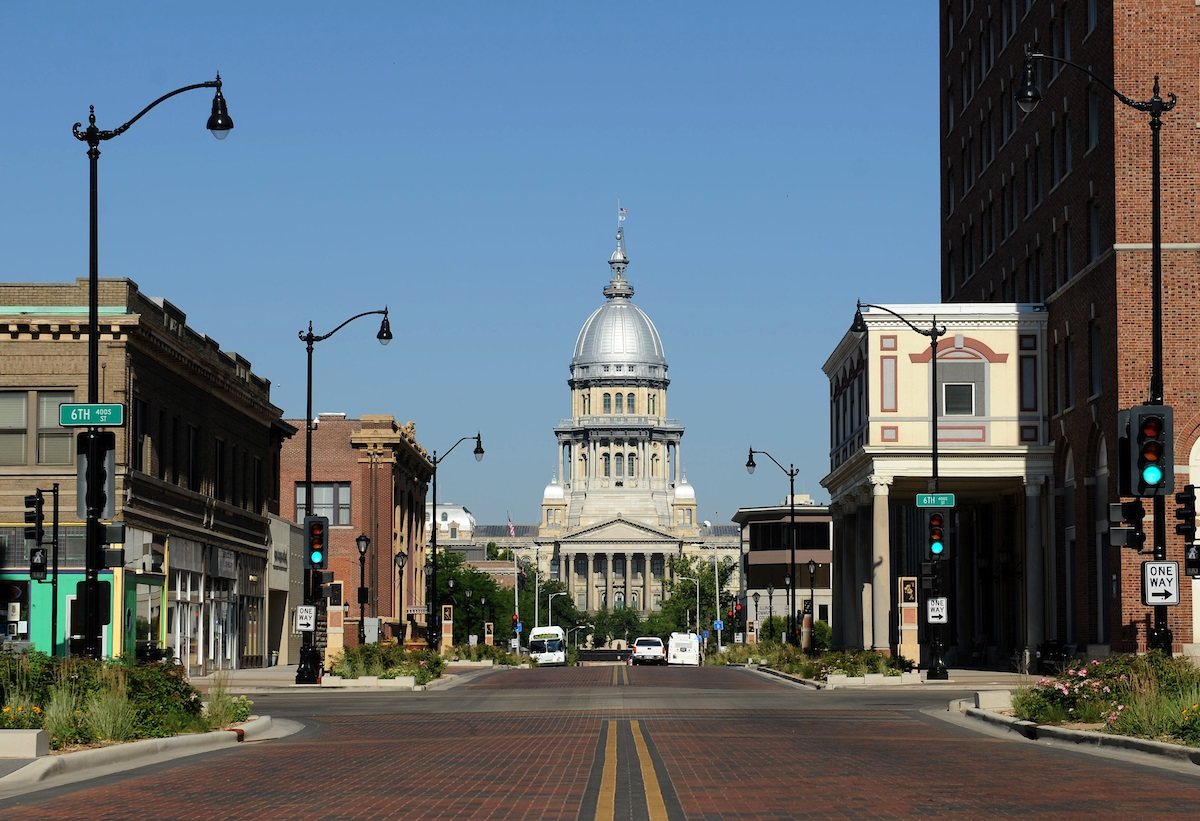 street view of downtown Springfield with the Illinois State Capitol in the distance