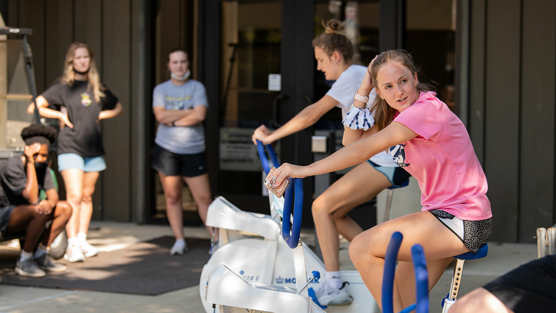 students practicing on stationary bikes