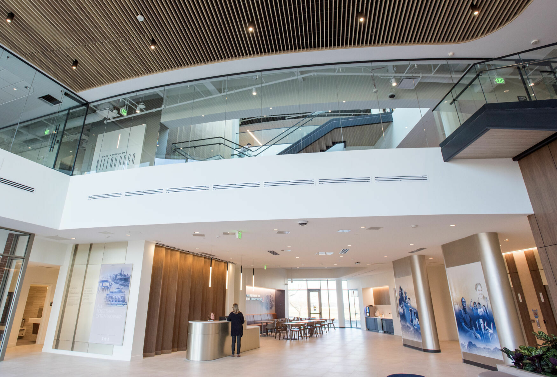 Lobby of the UIF Philanthropy Center that includes the front desk and the second floor balcony