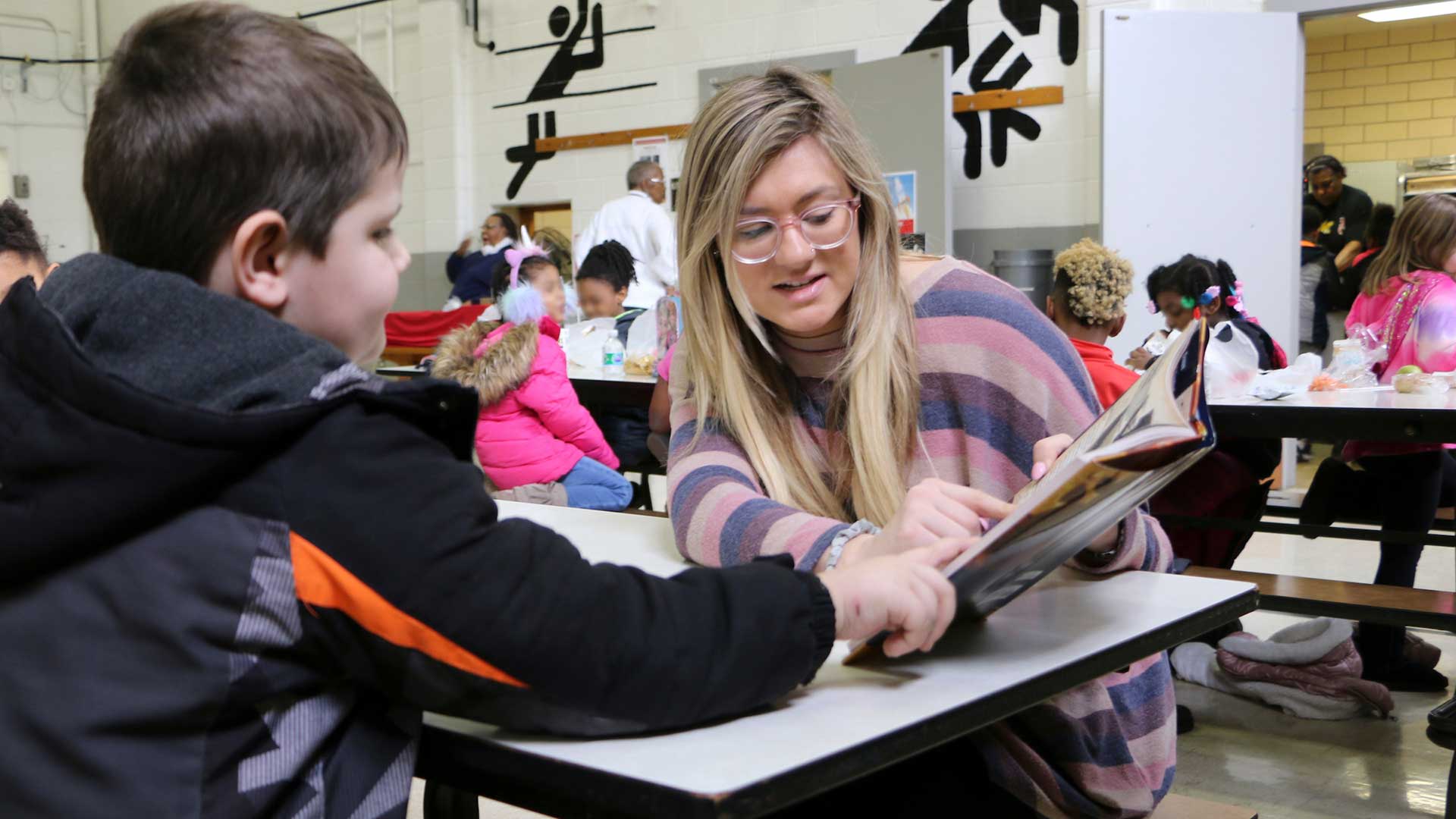 student working with child