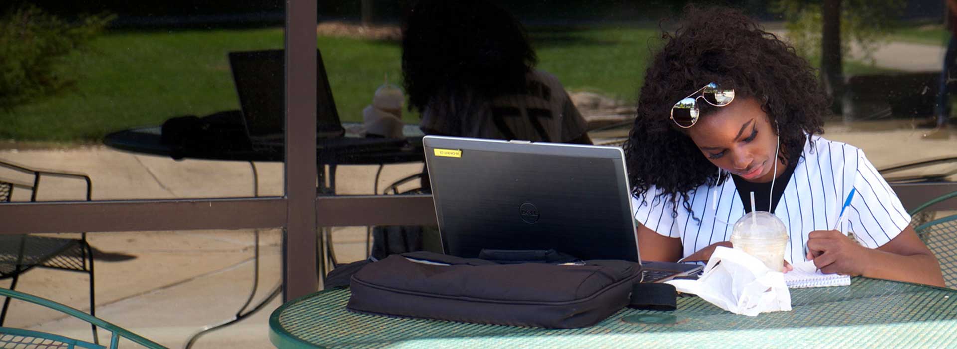 student at table