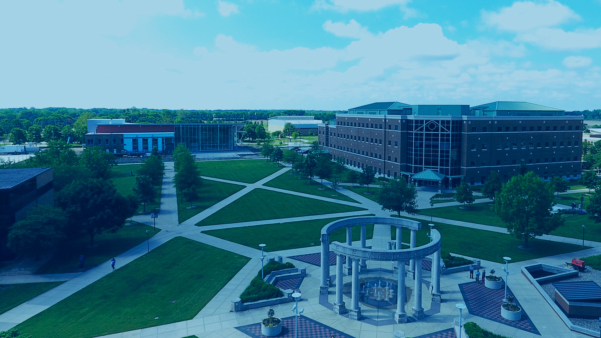 overhead view of colonnade, Student Union, and UHB with blue overlay