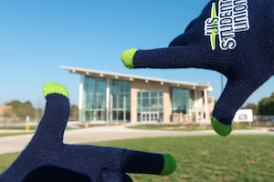 gloved hands framing the Student Union