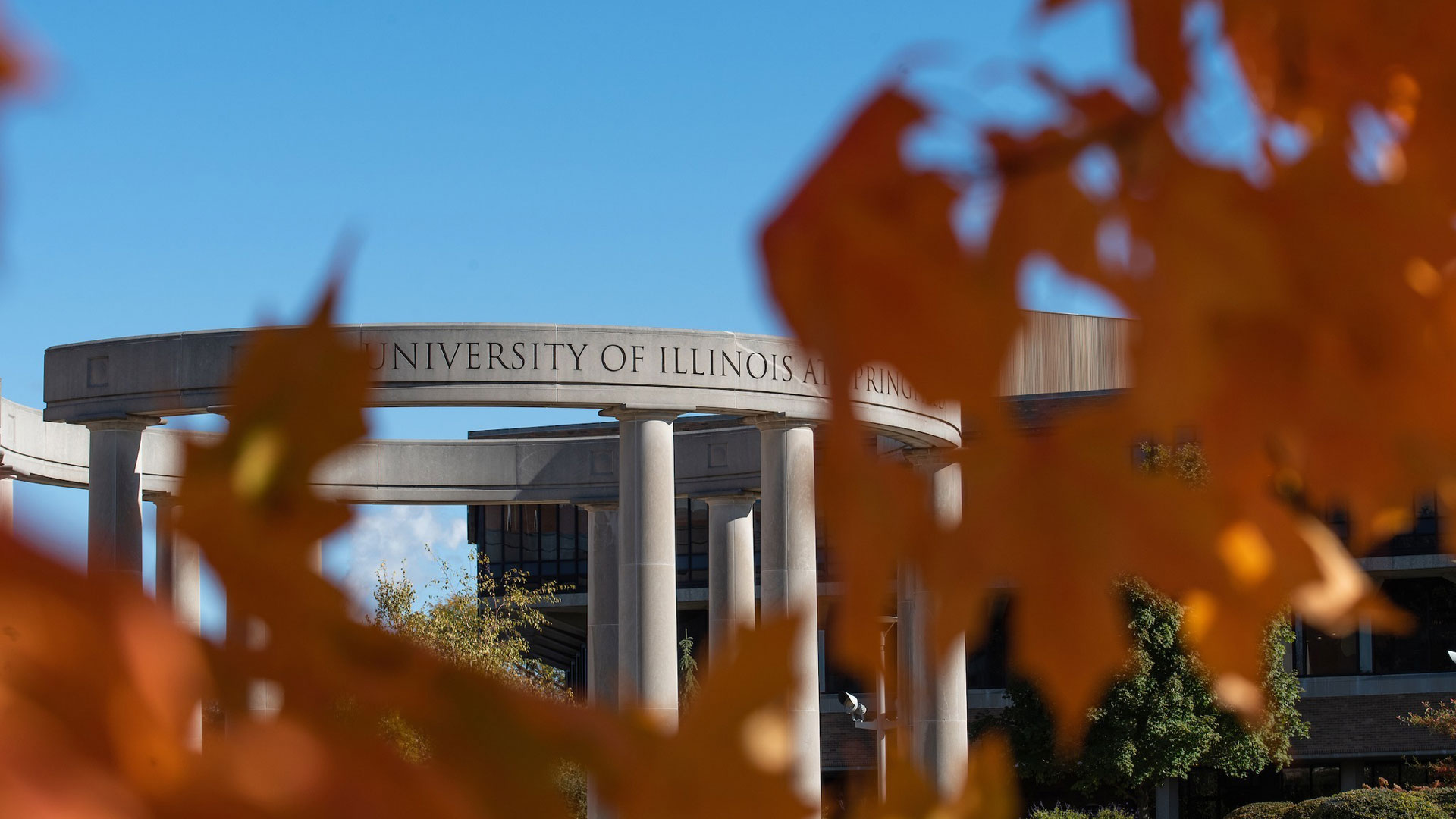 colonnade in the background with autumn foliage in the foreground