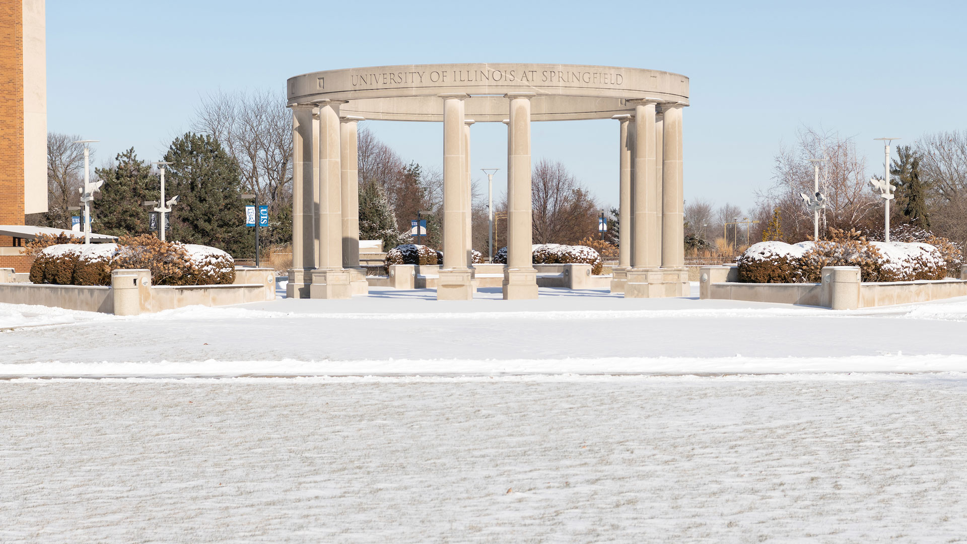 the colonnade in the background with a light snowfall in the foreground