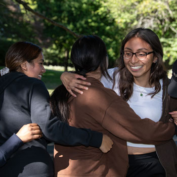 students embracing each other