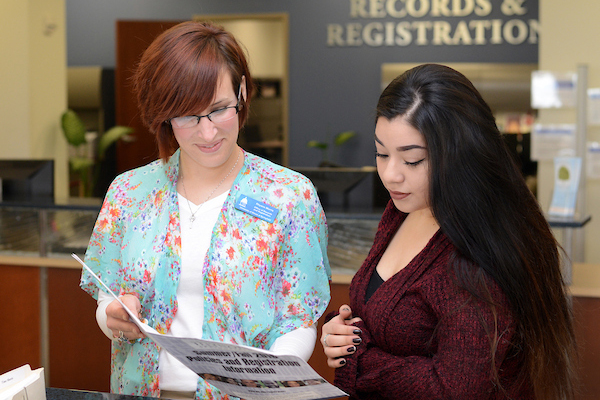Student receiving assistance at the Records and Registration office