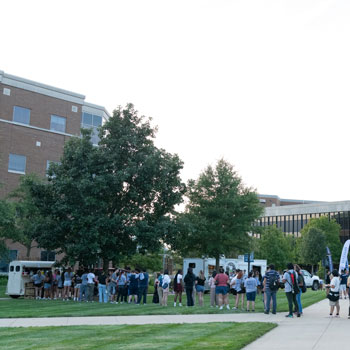 two students playing on the quad
