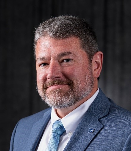 Brandon E. Schwab head-and-shoulders photo in business attire