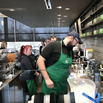 student workers working at the campus Starbucks