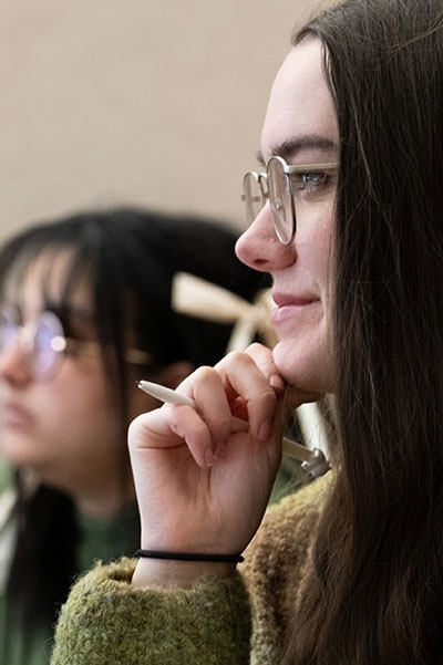 two female students paying attention in class