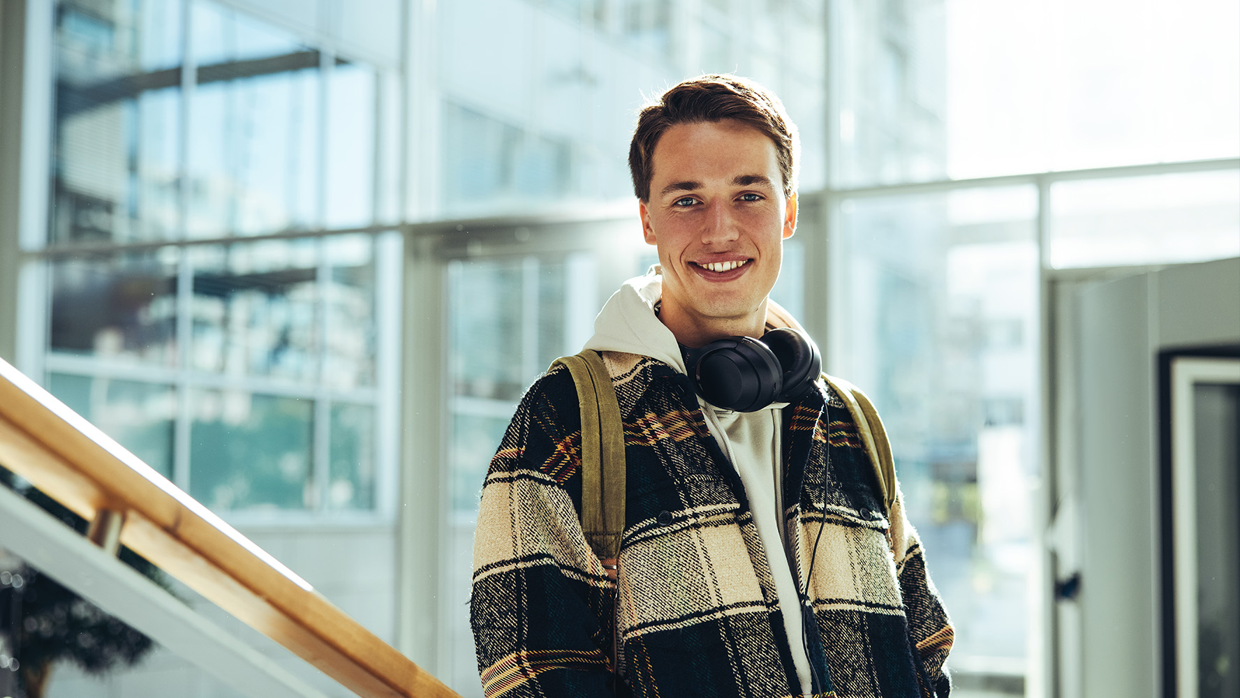 Male student smiling into the camera