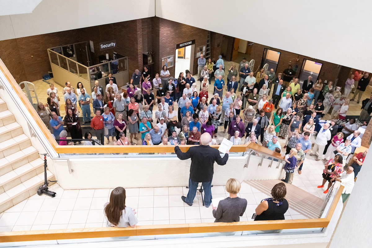 Randy Eccles speaking to the large crowd attending the opening of the exhibit Radio that Listens to You