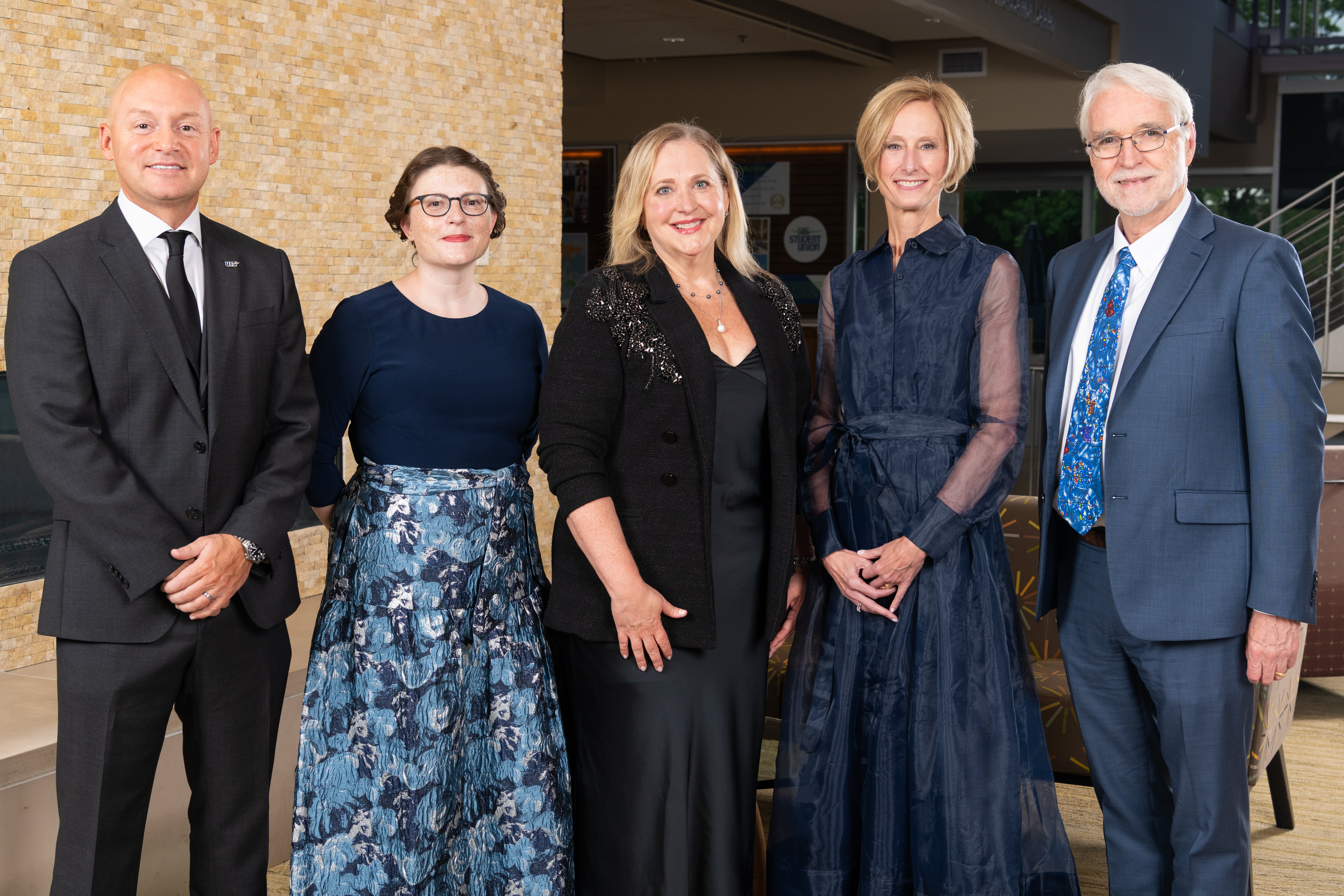 the alumni humanitarian award recipient with UIS and U of I System leadership