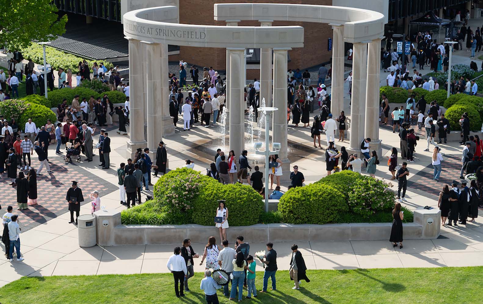 Graduates and families celebrating at UIS commencement
