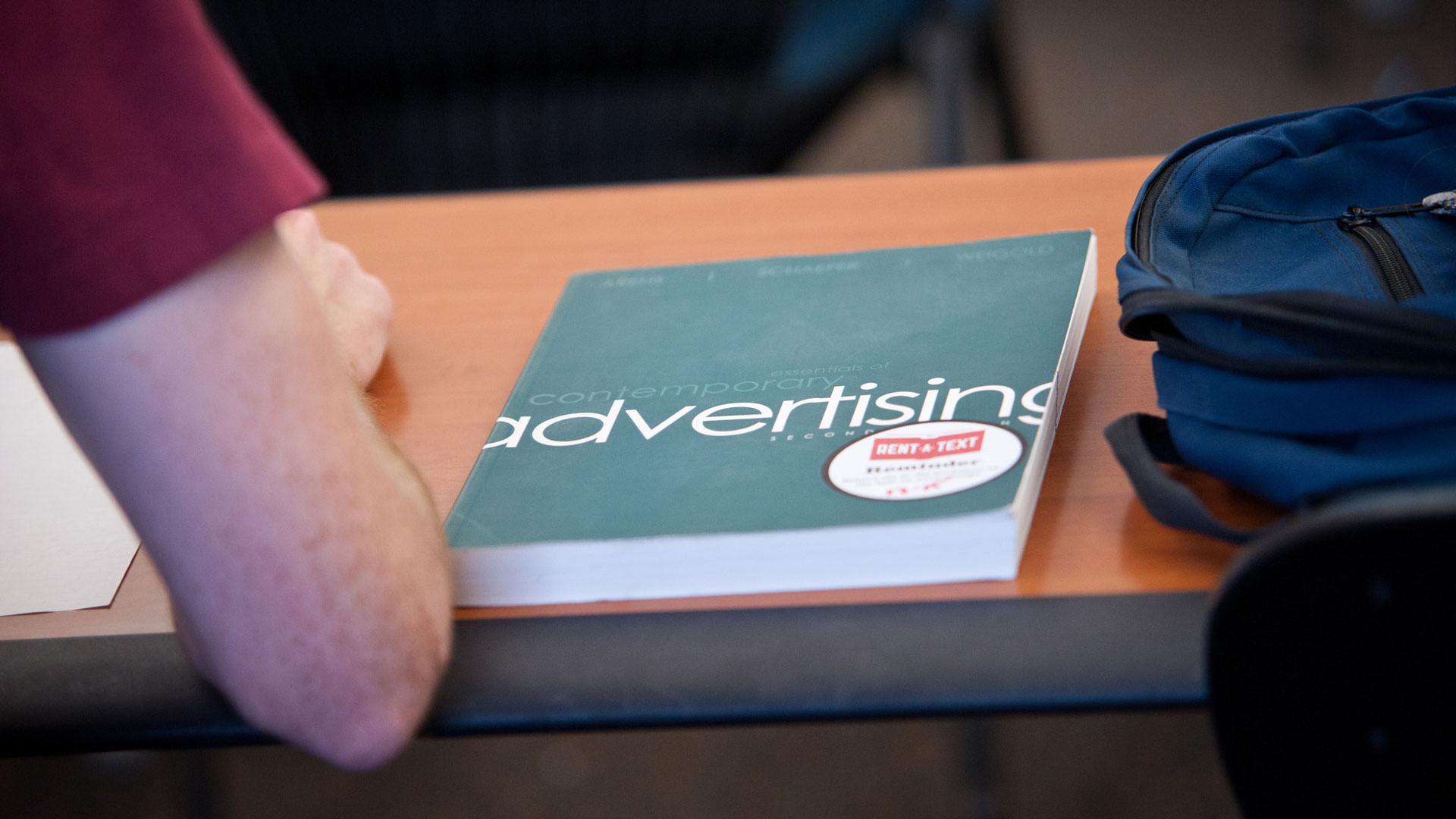 an advertising textbook on a student's desk