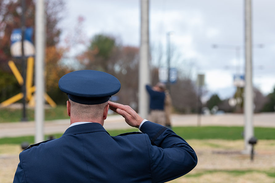 veteran saluting at the flag for veterans day