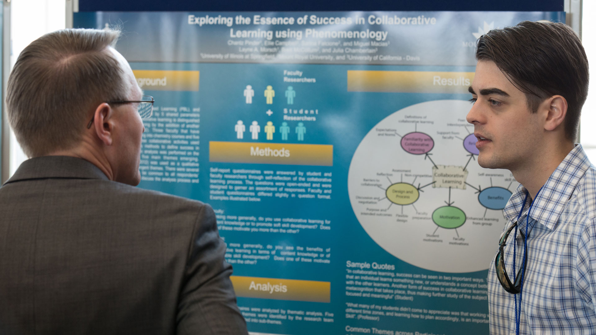 a student at STARS talking about his research to an audience member