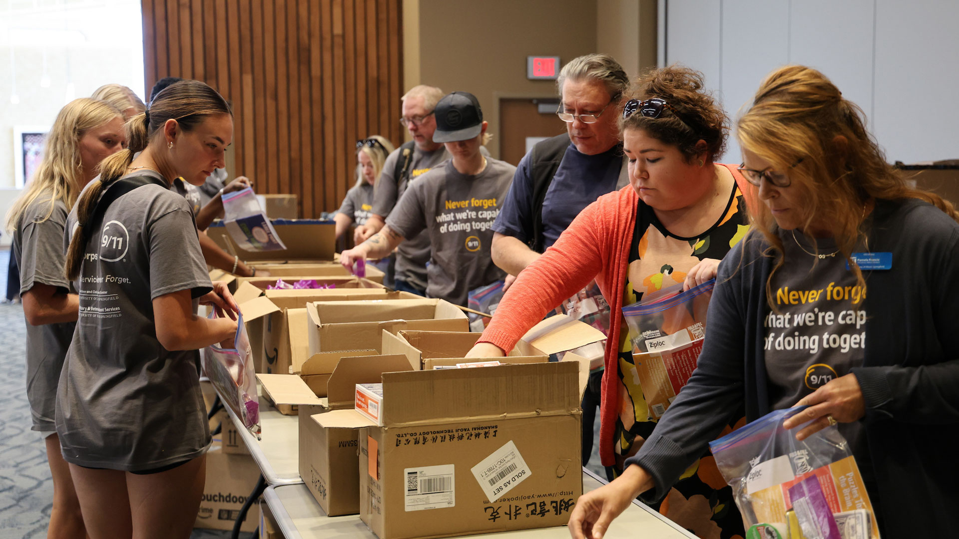 Volunteers assembling Day of Service packages