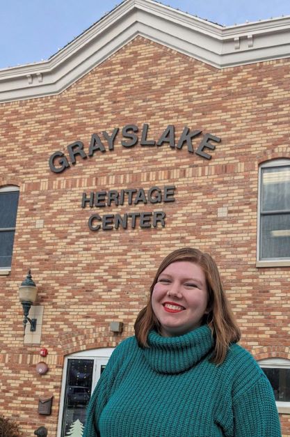 Katie Brethorst-Stockwell in front of Grayslake Heritage Center building