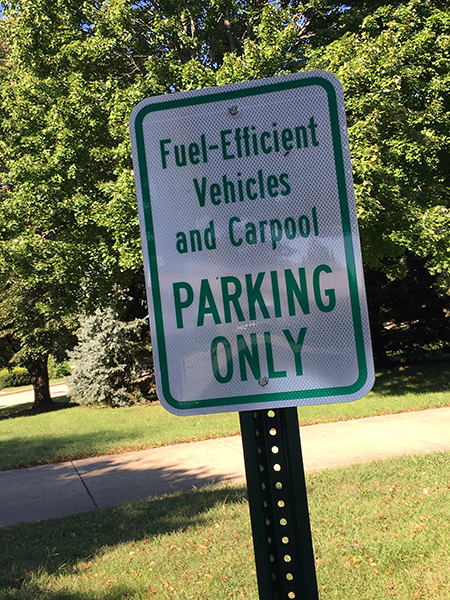 A sign that says "Fuel Efficient Vehicles and Carpool PARKING ONLY"