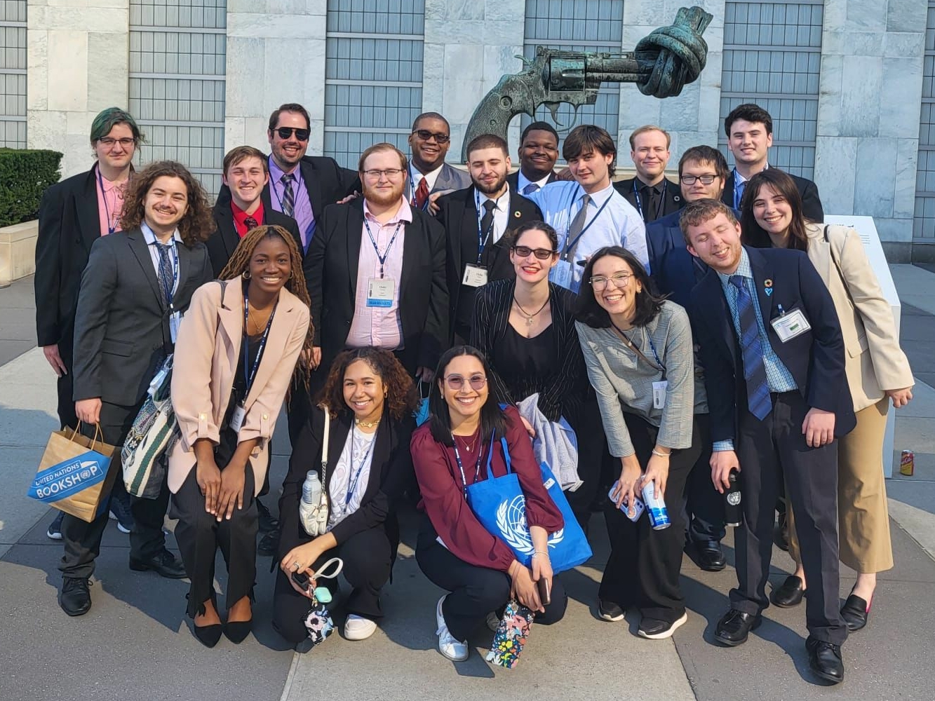 Picture of UIS Students outside the UN Building in front of the sculpture Non-Violence