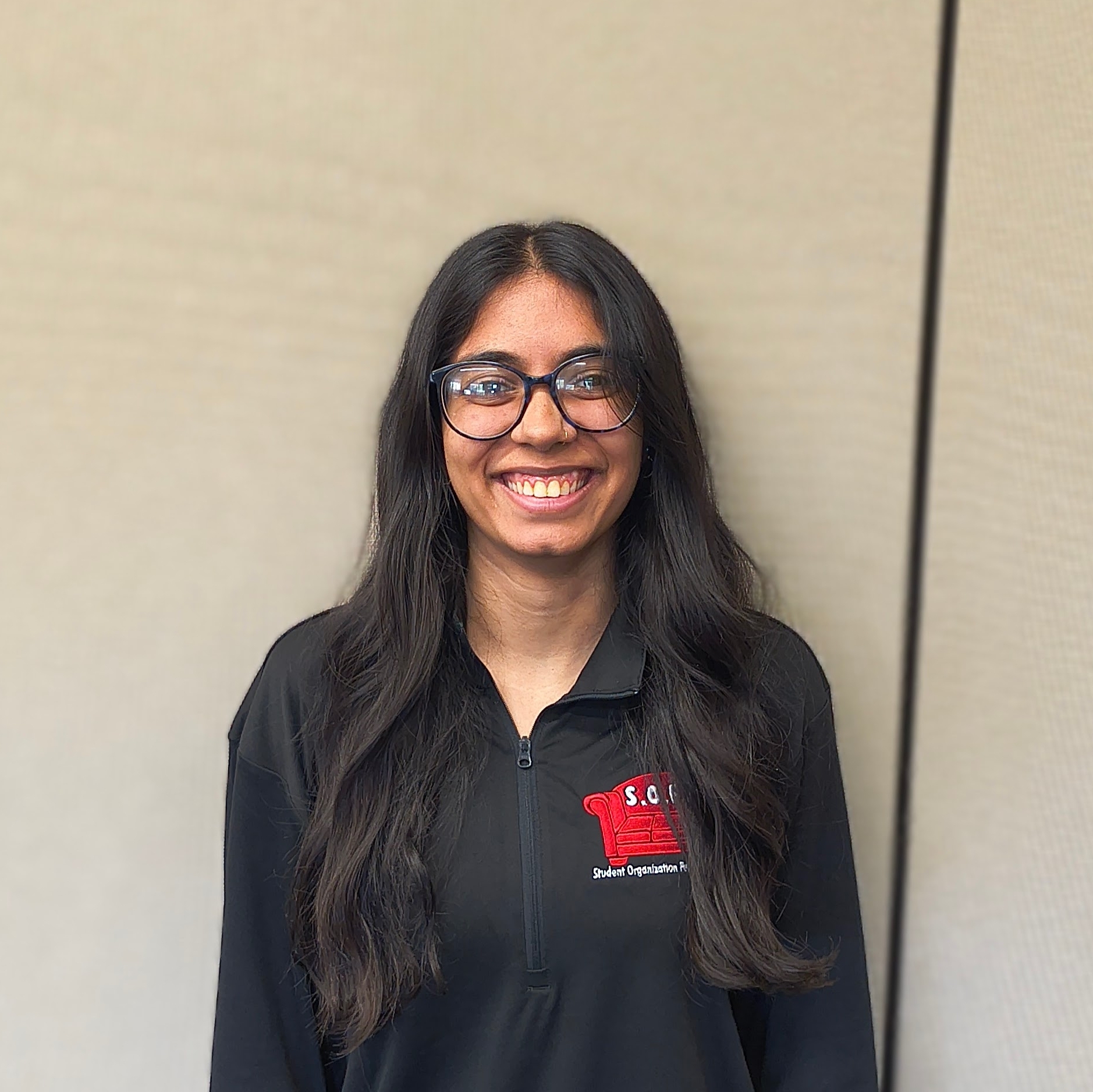 SOFA Treasurer, Diya Thakkar, smiling.