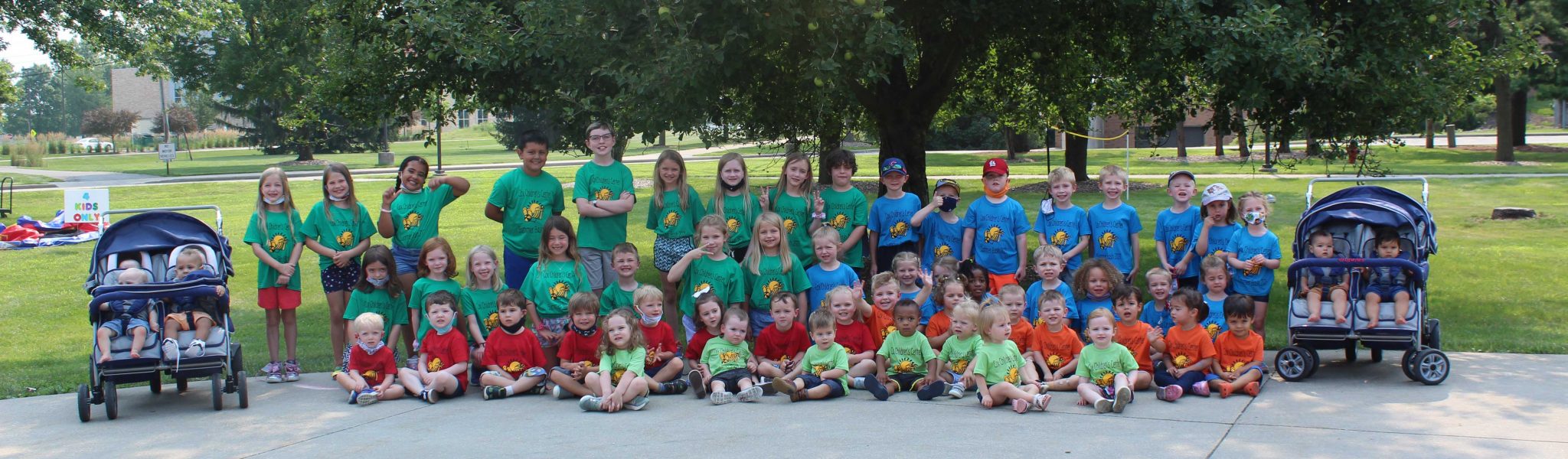child care students sitting together outside