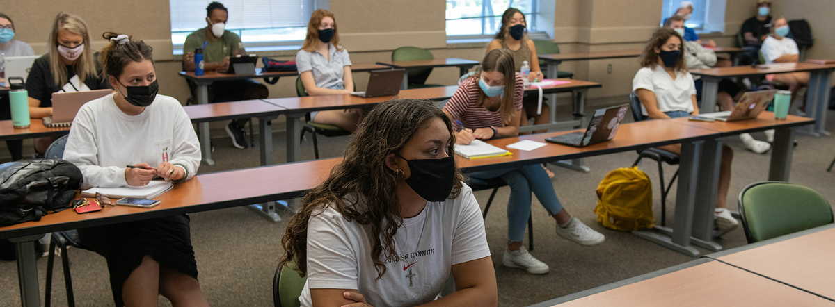 student in class with masks