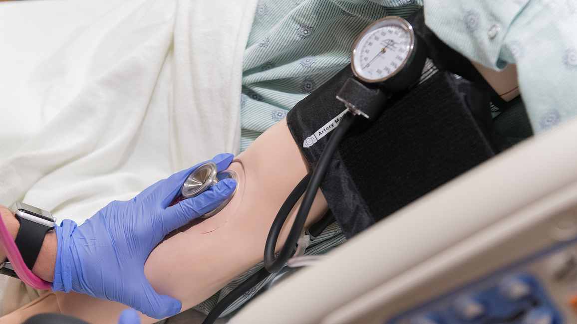 Nurse taking blood pressure 