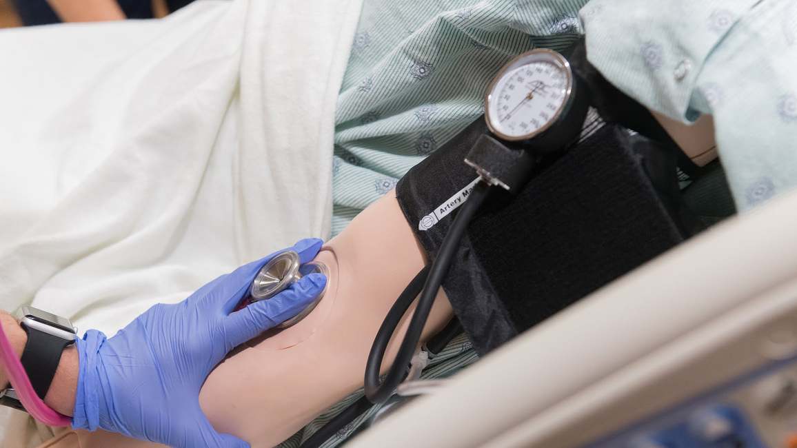 Nurse takes blood pressure 