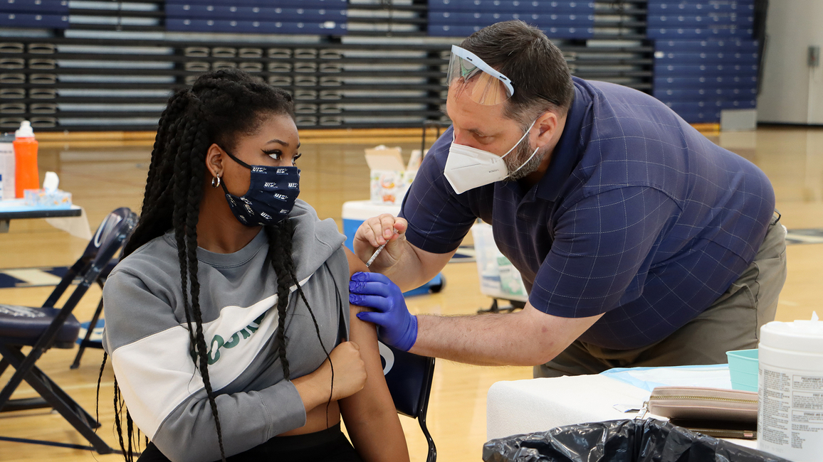 Student receiving a COVID-19 vaccine