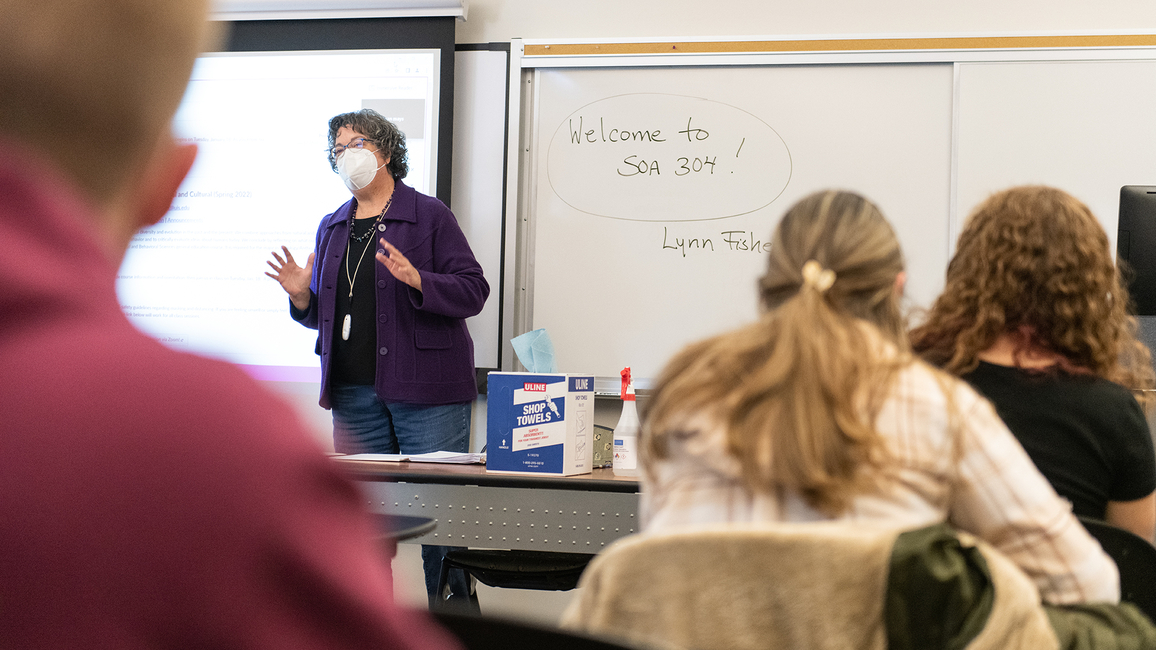 Professor teaching in-person class