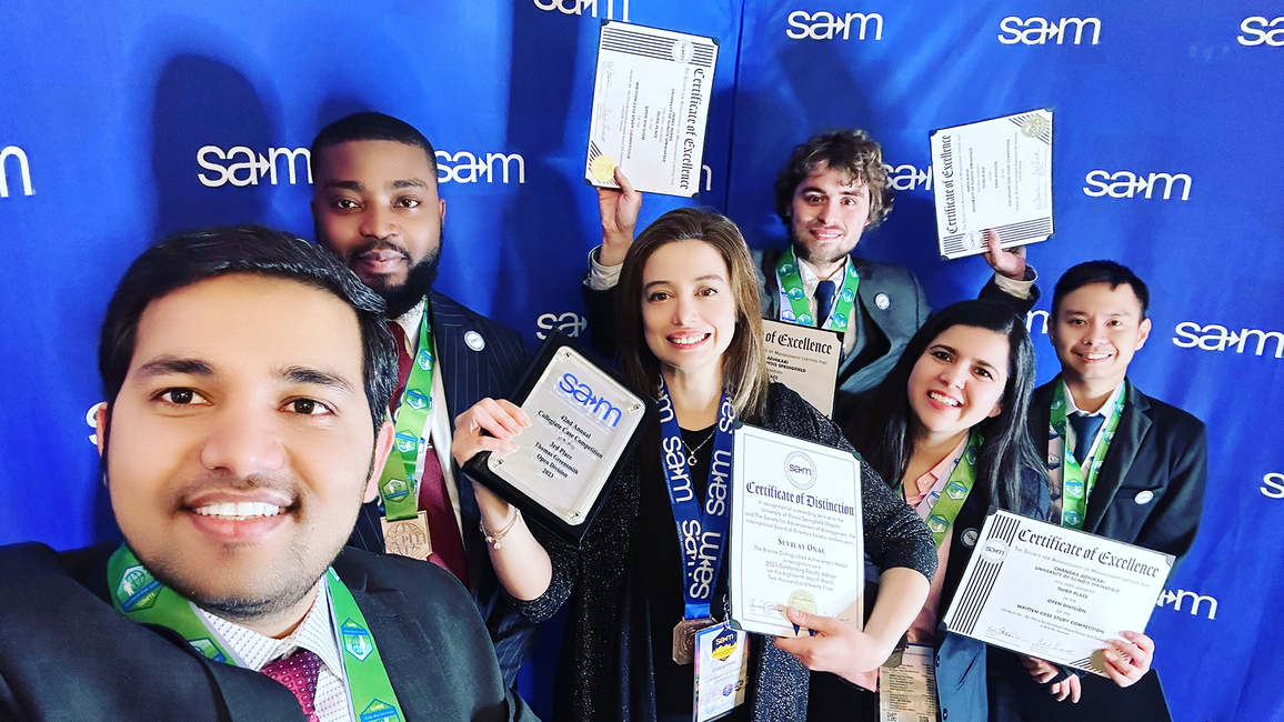 SAM students holding awards