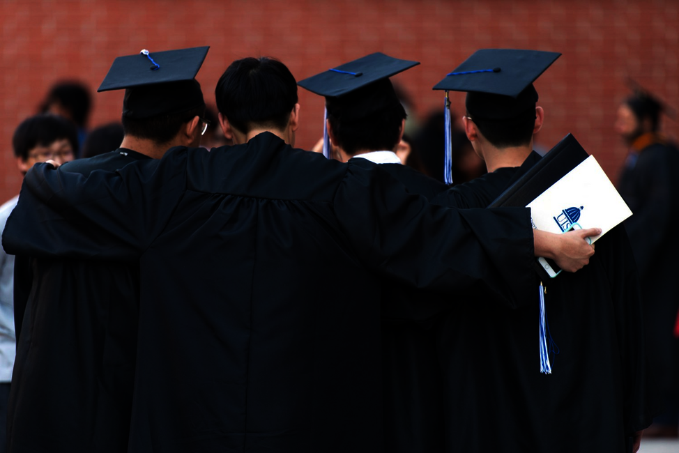 four international students graduation