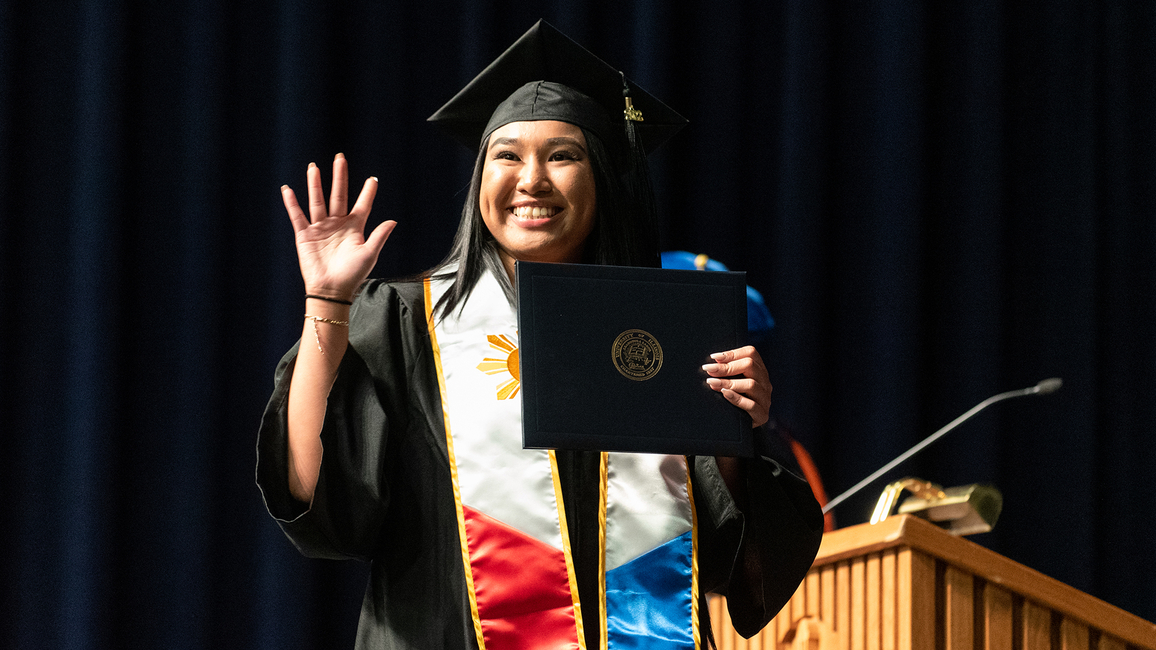 Graduate in cap and gown