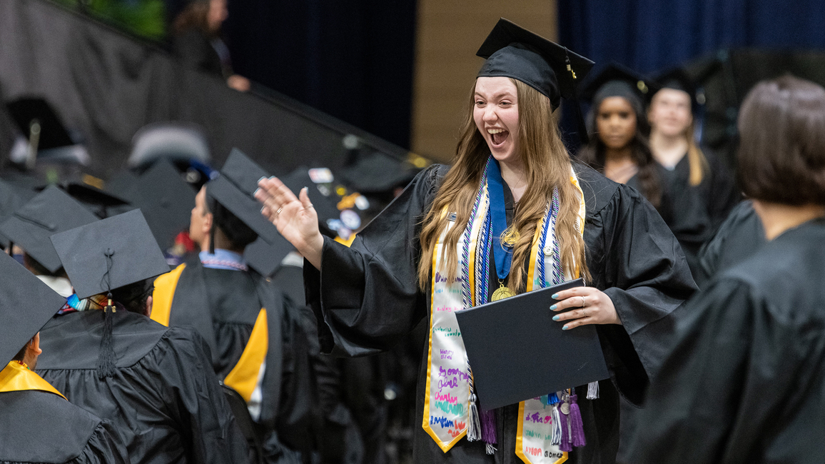 Grad in cap and gown