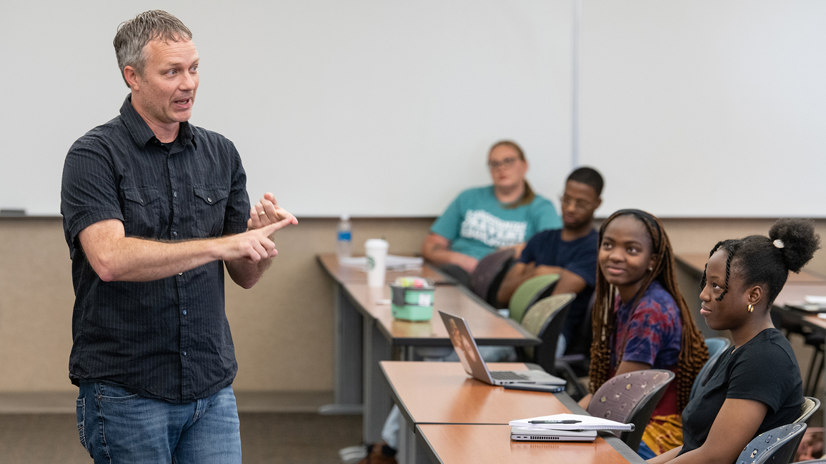 Professor teaching in-person class