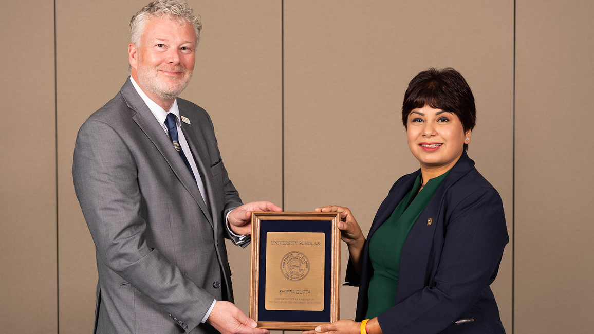 Shipra Gupta holding award