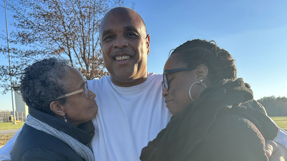 Brian Beals hugged by family members