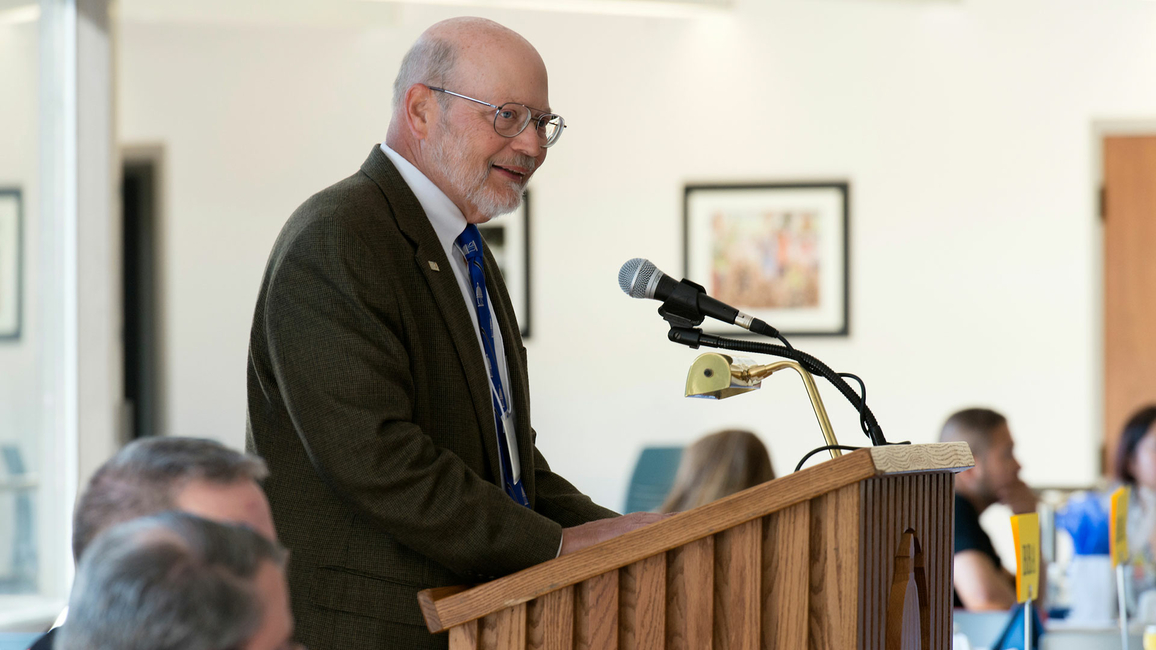 Ray Schroeder speaking at an event