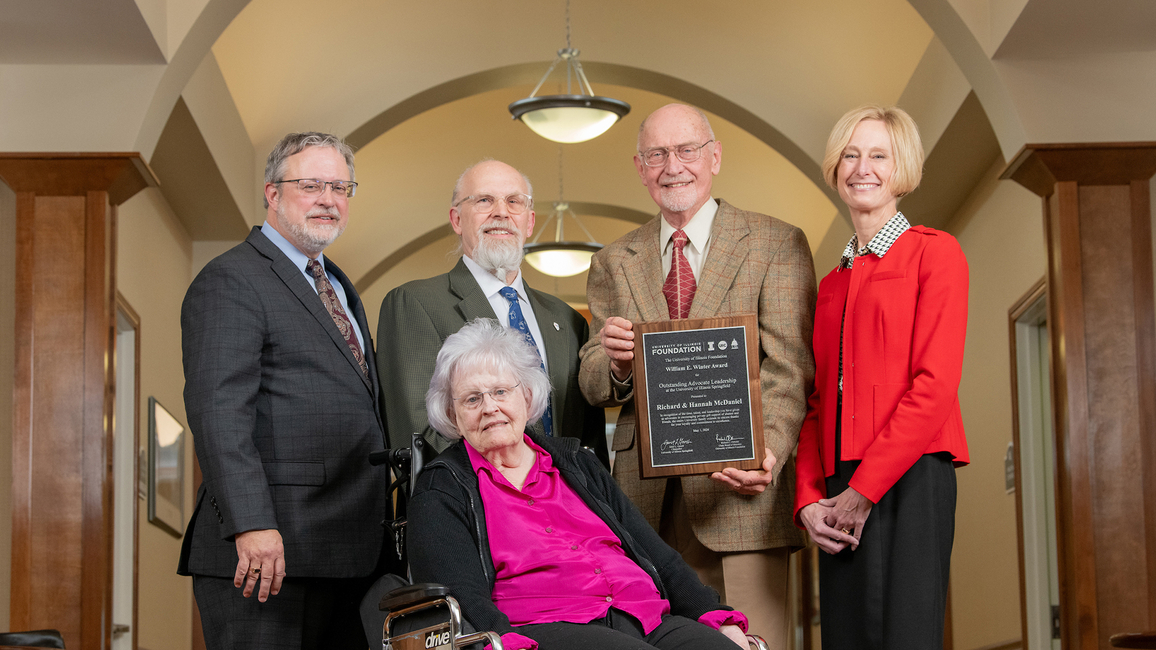 Vice Chancellor for Advancement Jeff Lorber, NPR Illinois General Manager Randy Eccles, Richard McDaniel and Chancellor Janet Gooch pose for a photo with Hannah McDaniel in the front row.