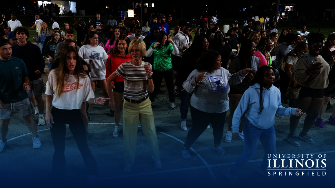 Chancellor Gooch dances with a crowd of students at RecPalooza.