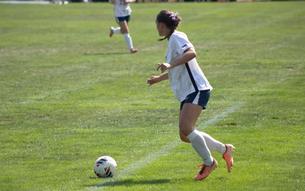 Abbie Gleason playing soccer